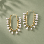Load image into Gallery viewer, Pearl-fringed U-frame earrings arranged on a sage-green surface