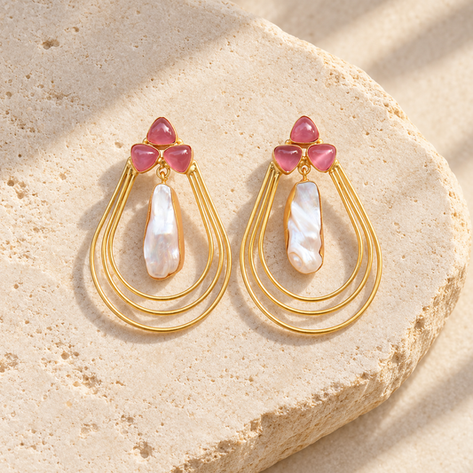 Pink Crystal & Pearl Layered Teardrop Earrings on warm limestone